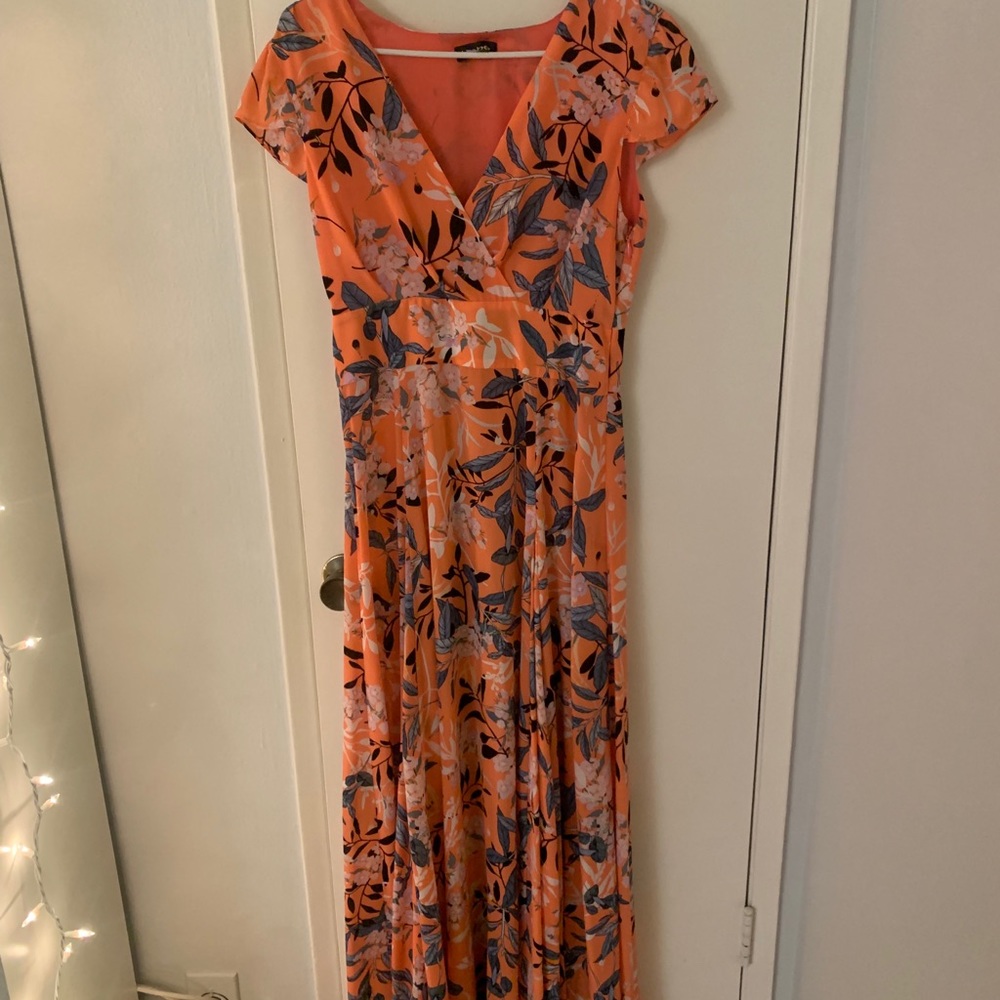 Beautiful Bebe orange dress with flower print.